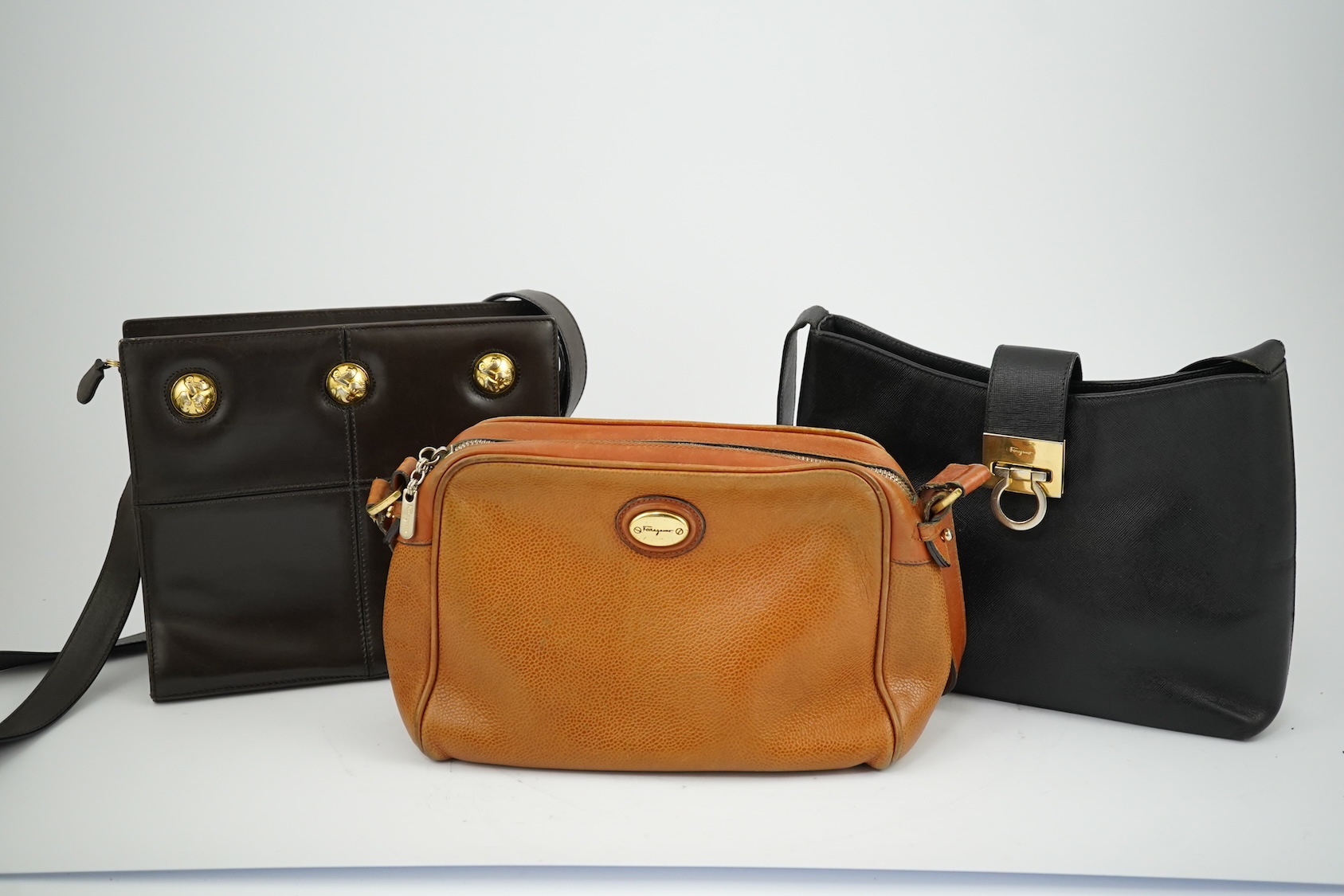 A Salvatore Ferragamo brown leather shoulder bag, and two other handbags